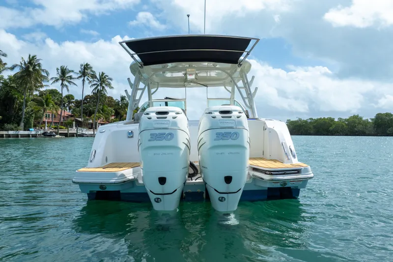 Slide: The Image of 2018 Boston Whaler 320 Vantage boat with twin 350 engines on tropical water. - 7
