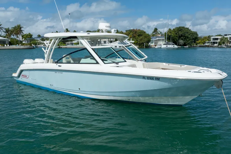 Slide: The Image of 2018 Boston Whaler 320 Vantage boat on calm water, clear sky background. - 9