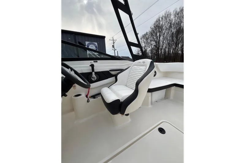Slide: The Image of 2023 Sea Ray SPX 210 boat interior with white and black seating. - 19