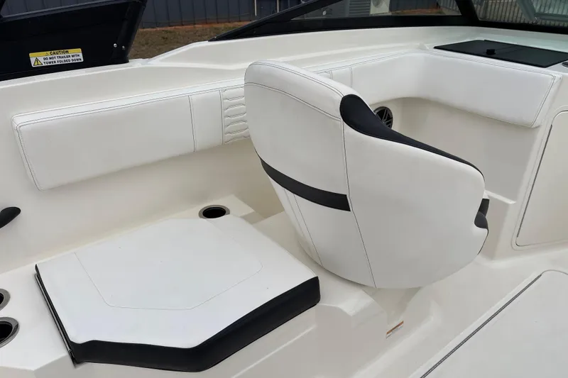 Slide: The Image of 2023 Sea Ray SPX 210 boat interior with white seating and sleek design. - 21