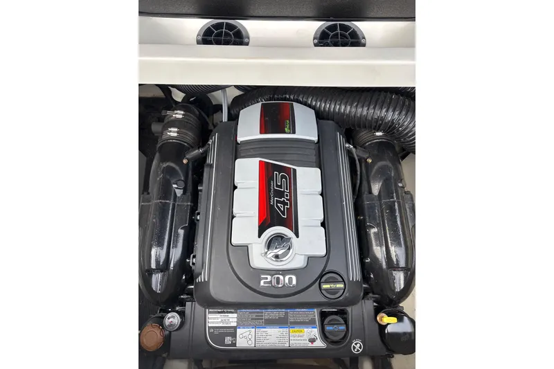 Slide: The Image of 2023 Sea Ray SPX 210 engine, showcasing a powerful 4.5L 200 HP MerCruiser. - 25