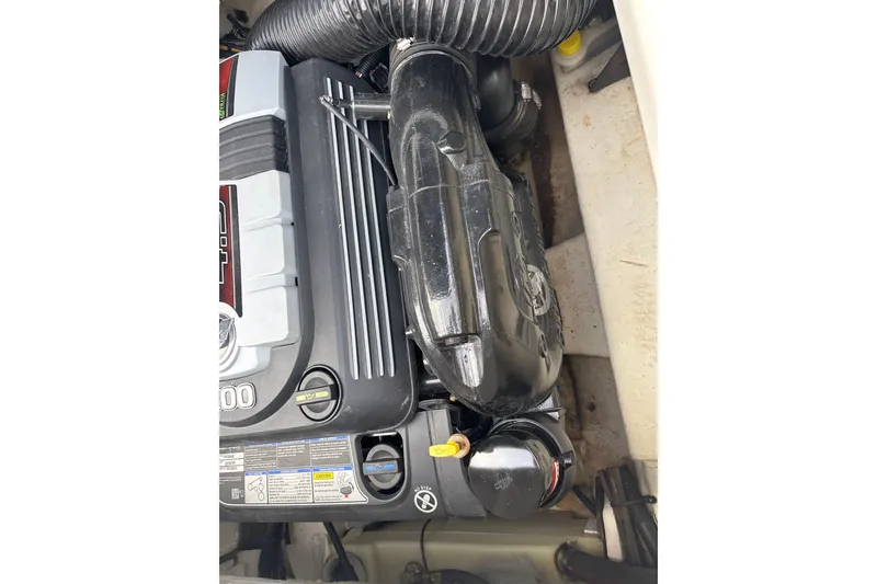 Slide: The Image of Engine compartment of 2023 Sea Ray SPX 210 boat, showcasing detailed components. - 26