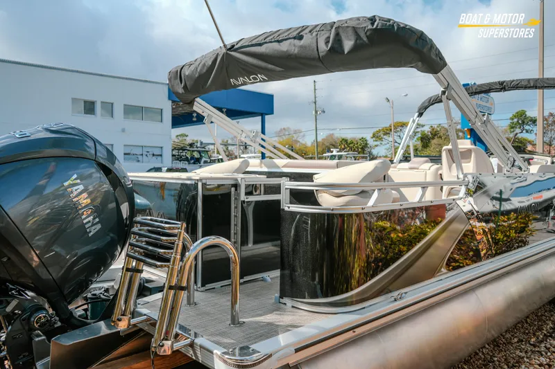 Slide: The Image of 2026 Avalon LSZ Rear Fish boat with Yamaha engine, showcased at a dealership. - 13