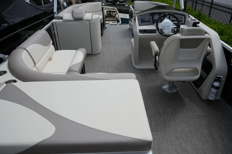 Slide: The Image of 2026 Avalon LSZ Rear Fish 23' boat interior with plush seating and modern helm. - 22