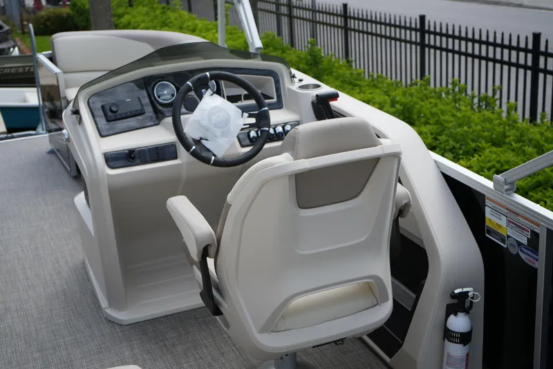 Slide: The Image of 2026 Avalon LSZ Rear Fish boat interior with steering console and captain's chair. - 25
