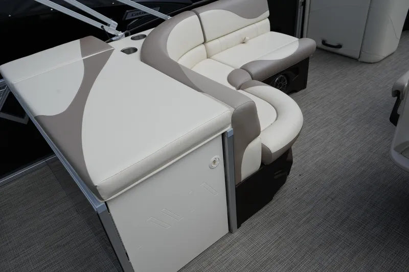 Slide: The Image of Luxurious seating on 2026 Avalon LSZ Rear Fish 23' pontoon boat, featuring beige and brown upholstery. - 26