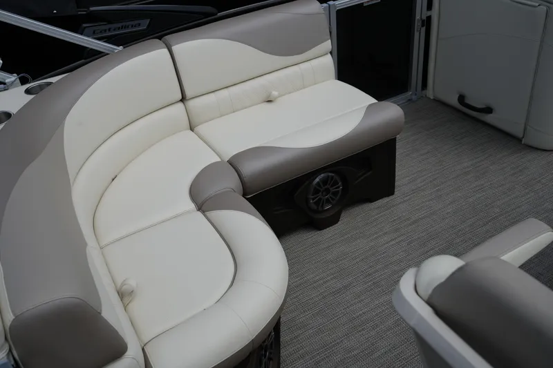Slide: The Image of Luxurious seating on 2026 Avalon LSZ Rear Fish boat, featuring beige and brown upholstery. - 27