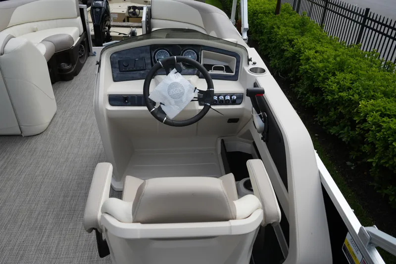 Slide: The Image of 2026 Avalon LSZ Rear Fish boat interior with steering wheel and seating. - 29