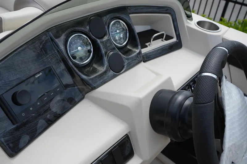 Slide: The Image of Dashboard of 2026 Avalon LSZ Rear Fish boat with steering wheel and gauges. - 33