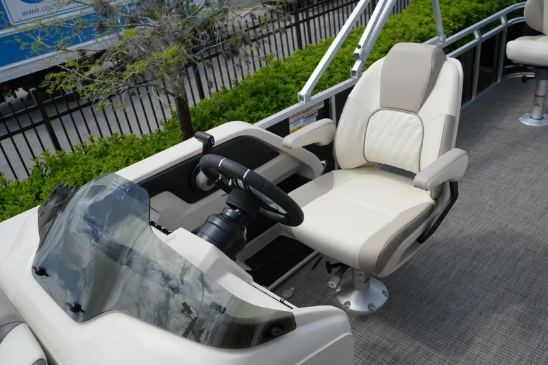 Slide: The Image of 2026 Avalon LSZ Rear Fish boat interior with captain's chair and steering console. - 38