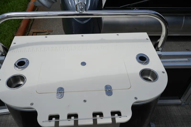 Slide: The Image of 2026 Avalon LSZ Rear Fish boat console with cup holders and storage compartment. - 42