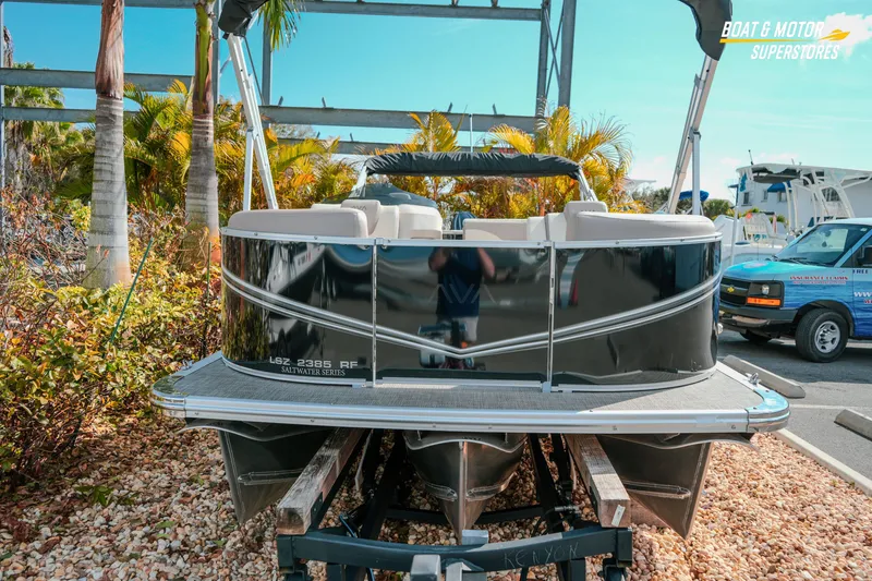 Slide: The Image of 2026 Avalon LSZ Rear Fish pontoon boat on display at dealership. - 7