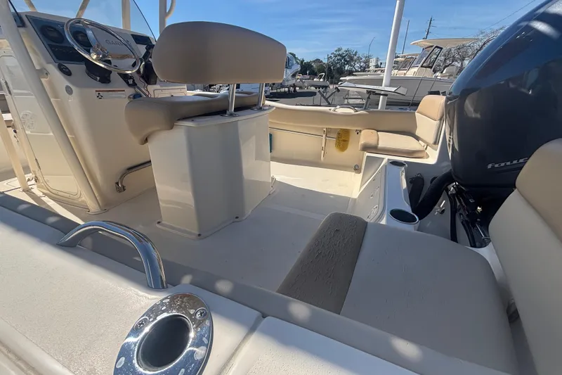Slide: The Image of 2022 Scout 195 Sportfish boat interior with seating and steering console. - 10