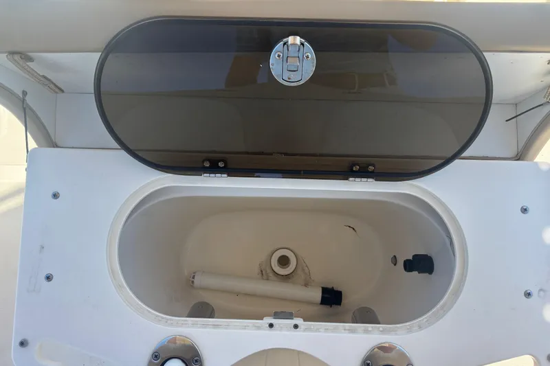 Slide: The Image of Open storage compartment on 2022 Scout 195 Sportfish boat. - 13