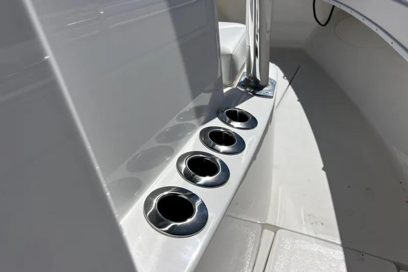 Slide: The Image of 2025 Contender 25 Tournament boat with stainless steel cup holders in sunlight. - 10