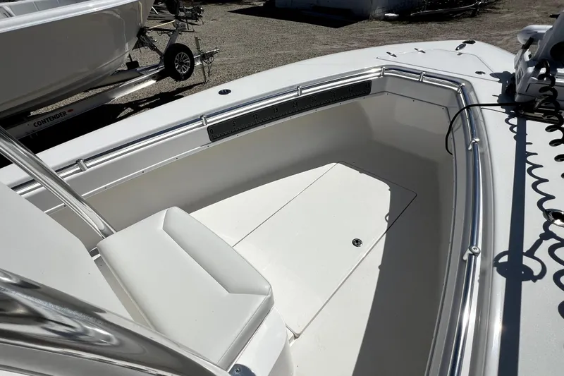 Slide: The Image of 2025 Contender 25 Tournament boat interior with seating and stainless steel railings. - 11