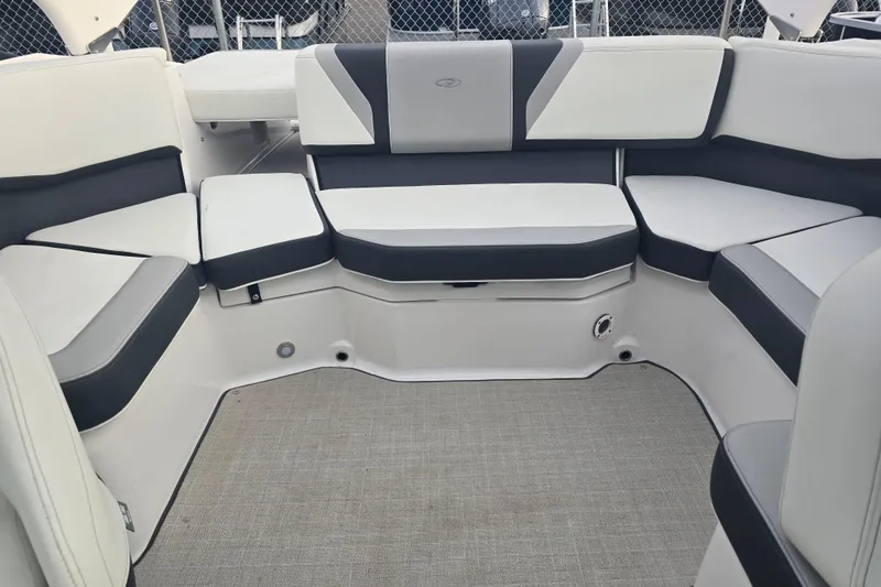 Slide: The Image of Interior of Regal 2000 ES boat, 2022 model, featuring gray and white seating. - 8