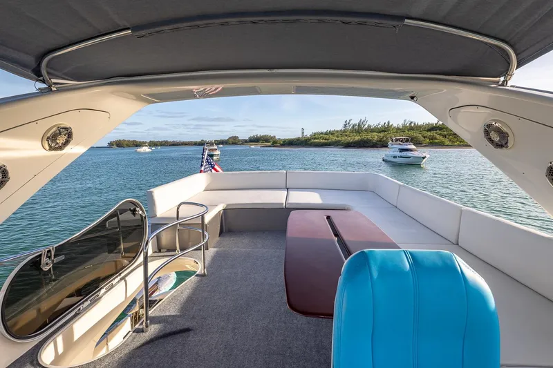 Slide: The Image of Azimut Fly 68 yacht interior, 2003 model, with scenic water view and seating area. - 10