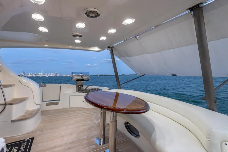 Slide: The Image of Luxurious 2003 Azimut Fly 68 yacht interior with ocean view and elegant seating area. - 16