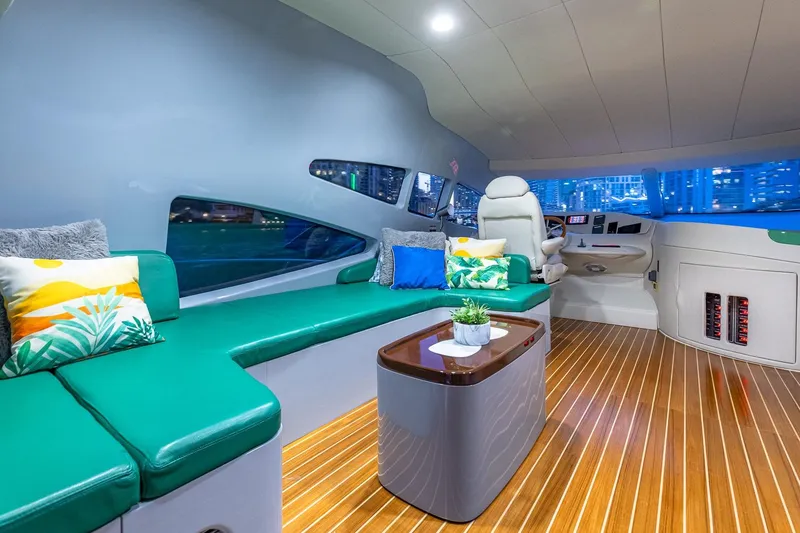 Slide: The Image of Luxurious interior of 2003 Azimut Fly 68 yacht with green seating and modern helm. - 19