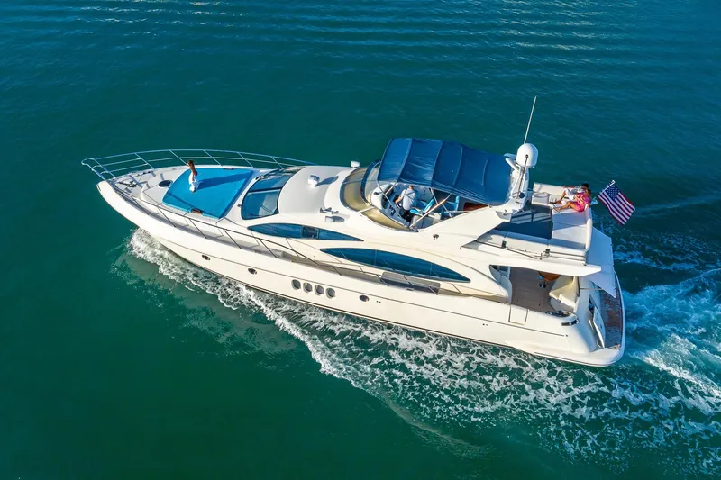 Slide: The Image of Azimut Fly 68 yacht cruising on open water, 2003 model, aerial view. - 2