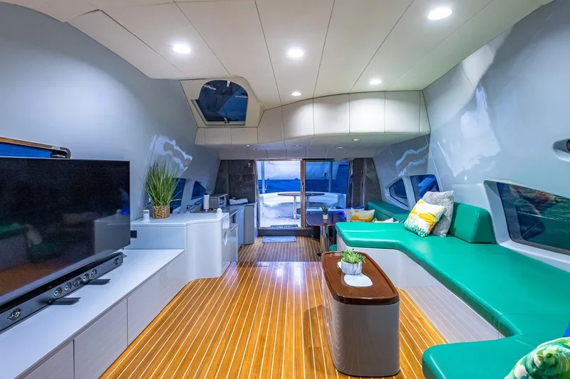 Slide: The Image of Luxurious interior of 2003 Azimut Fly 68 yacht with modern decor and spacious seating. - 21
