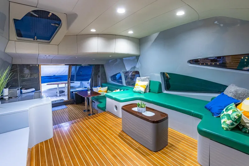 Slide: The Image of Luxurious interior of 2003 Azimut Fly 68 yacht with modern seating and wooden flooring. - 22