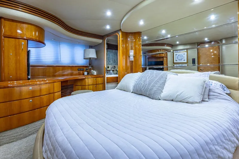 Slide: The Image of Luxurious bedroom interior of 2003 Azimut Fly 68 yacht with elegant wood finishes. - 23