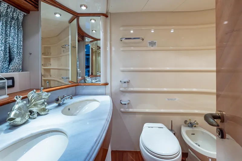 Slide: The Image of Luxurious bathroom in 2003 Azimut Fly 68 yacht with elegant fixtures and dual sinks. - 25