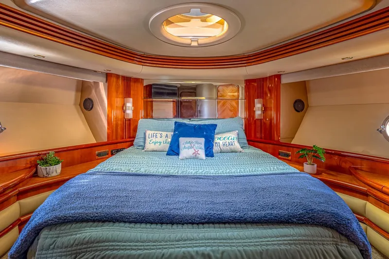Slide: The Image of Luxurious bedroom interior of 2003 Azimut Fly 68 yacht with cozy bedding and decor. - 28
