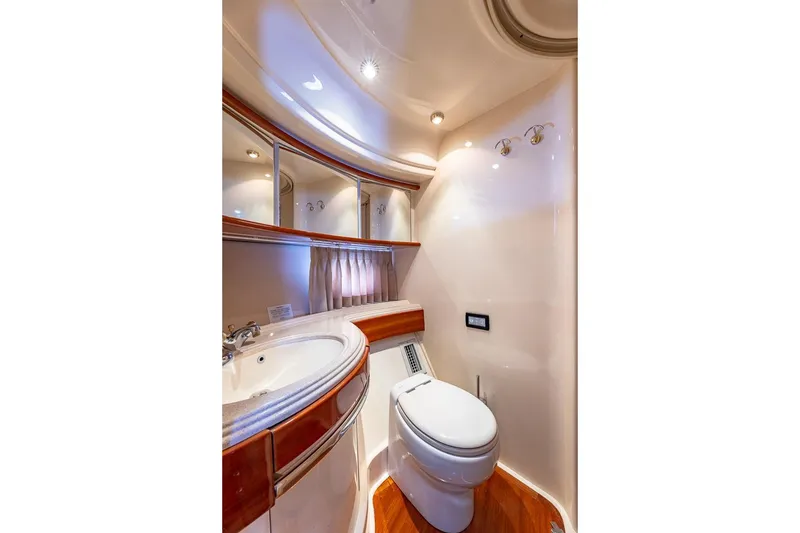 Slide: The Image of Luxurious bathroom in 2003 Azimut Fly 68 yacht with elegant fixtures and wood accents. - 30