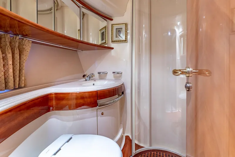 Slide: The Image of Luxurious bathroom interior of 2003 Azimut Fly 68 yacht with elegant wood finishes. - 35