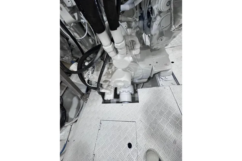 Slide: The Image of Engine room of 2003 Azimut Fly 68 yacht, showcasing mechanical components and piping. - 42