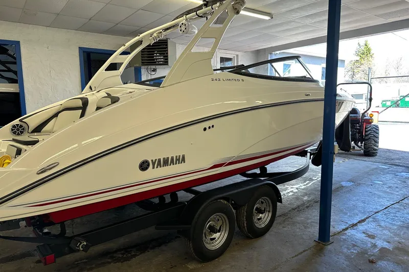 Slide: The Image of 2019 Yamaha Boats 242 Limited S on trailer in indoor storage. - 3