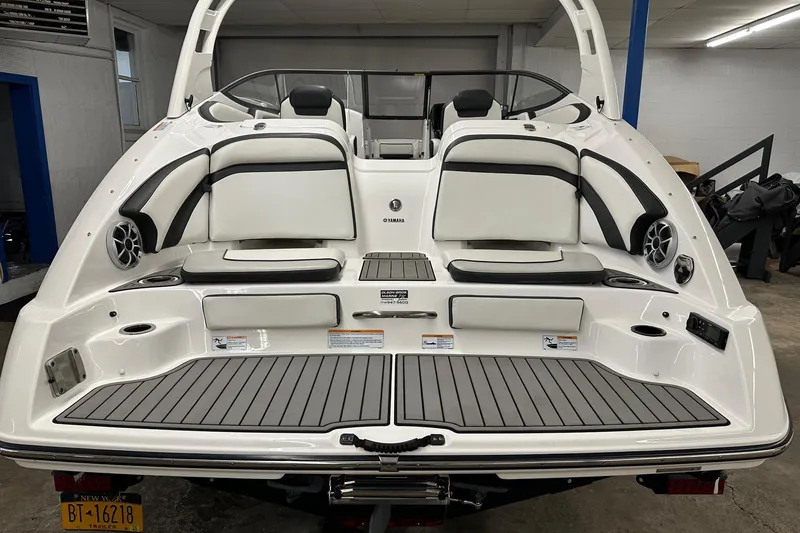 Slide: The Image of 2019 Yamaha Boats 242 Limited S, rear view, showcasing seating and deck features. - 4