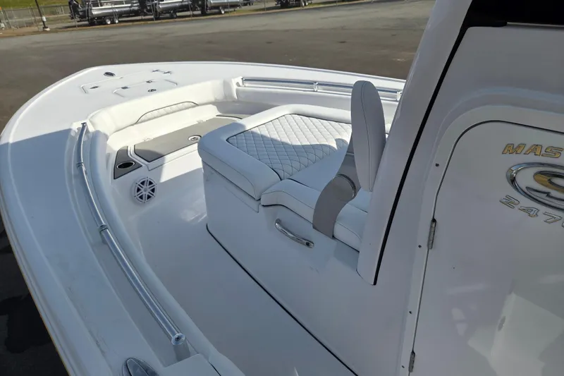 Slide: The Image of 2026 Sportsman Masters 247OE Bay Boat interior with cushioned seating and sleek design. - 10