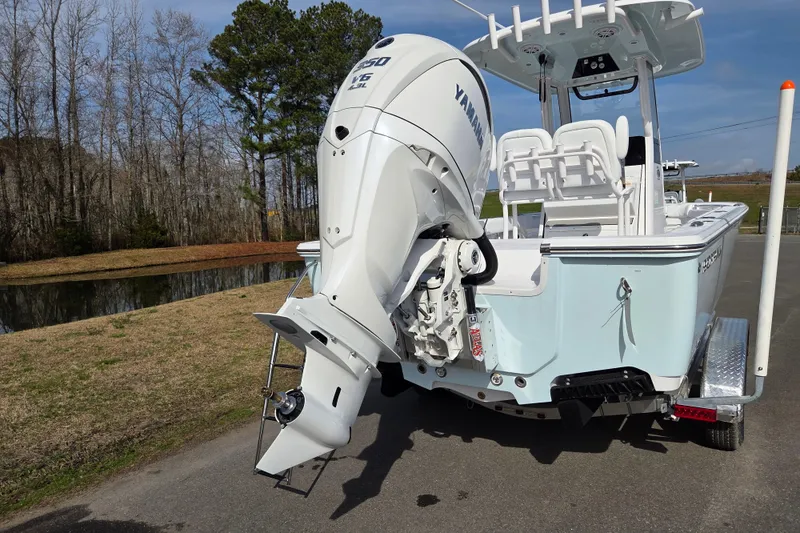 Slide: The Image of 2026 Sportsman Masters 247OE Bay Boat with Yamaha V6 engine on a trailer. - 3