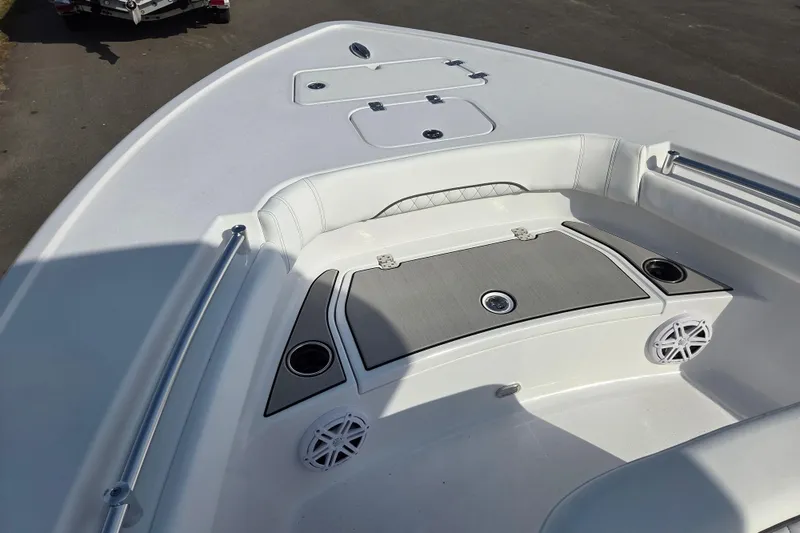 Slide: The Image of 2026 Sportsman Masters 247OE Bay Boat interior with seating and storage compartments. - 8