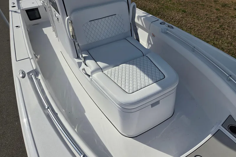 Slide: The Image of 2026 Sportsman Masters 247OE Bay Boat with cushioned seating and sleek design. - 9