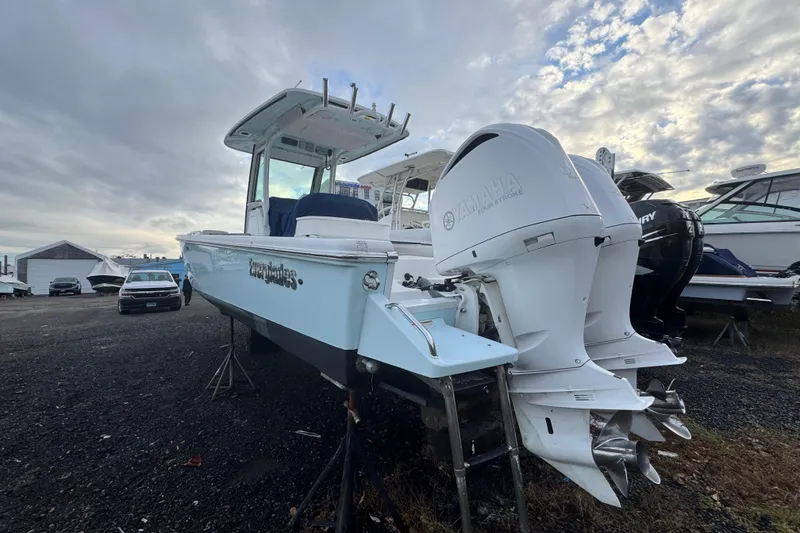 Slide: The Image of 2019 Everglades 273 Center Console boat with twin Yamaha engines on display. - 1