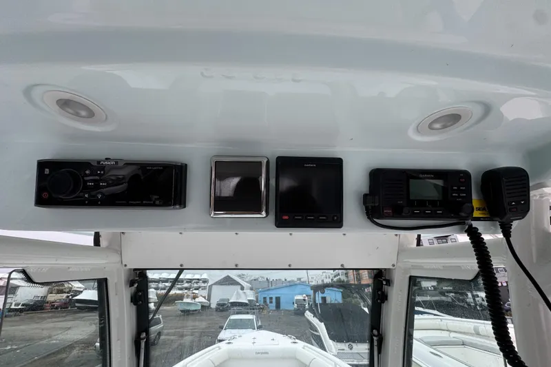 Slide: The Image of 2019 Everglades 273 Center Console dashboard with navigation and communication equipment. - 11