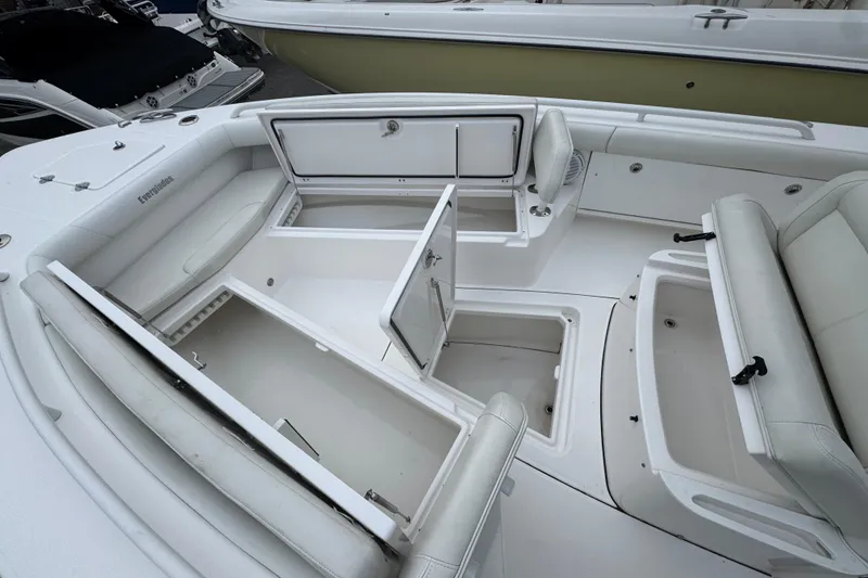 Slide: The Image of 2019 Everglades 273 Center Console boat interior with open storage compartments. - 12
