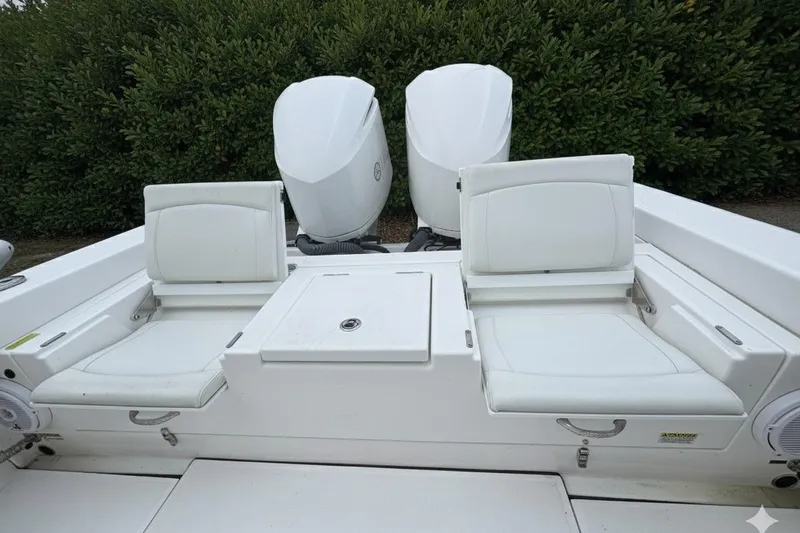 Slide: The Image of 2019 Everglades 273 Center Console boat with dual engines and white seating. - 6