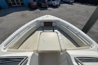 Slide: The Image of 2023 Cobia 220 Dual Console boat with spacious bow seating area. - 8