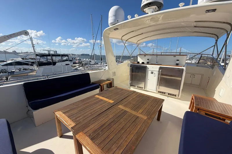 Slide: The Image of 1987 Hatteras 58 Motor Yacht deck with seating and ocean view. - 22