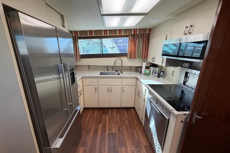 Slide: The Image of Modern kitchen interior on 1987 Hatteras 58 Motor Yacht with stainless steel appliances. - 42