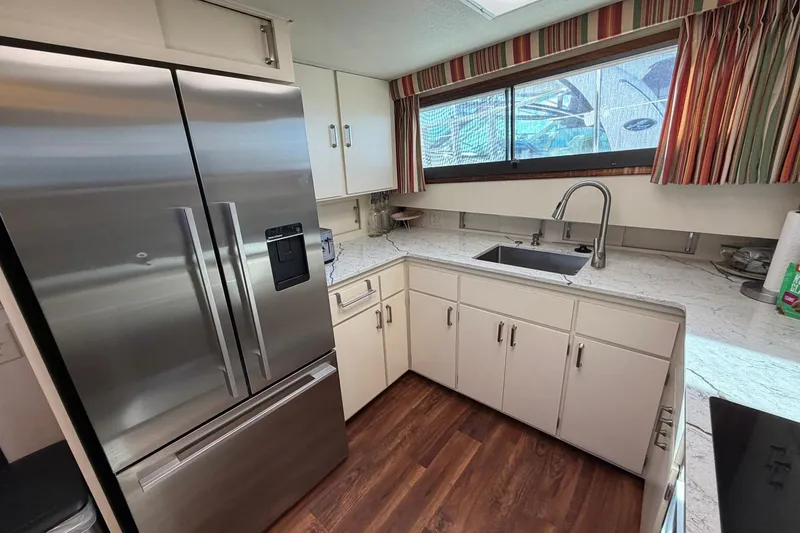 Slide: The Image of Modern kitchen interior on 1987 Hatteras 58 Motor Yacht with stainless steel appliances. - 43