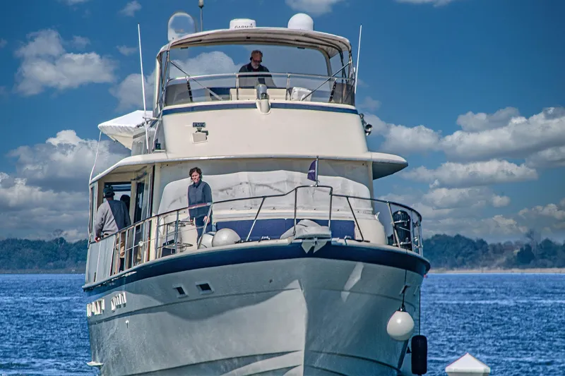 Slide: The Image of 1987 Hatteras 58 Motor Yacht cruising on a sunny day with blue skies. - 5