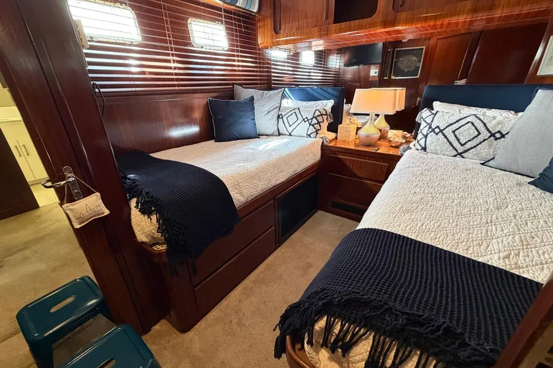 Slide: The Image of Luxurious cabin interior of 1987 Hatteras 58 Motor Yacht with twin beds and elegant decor. - 53