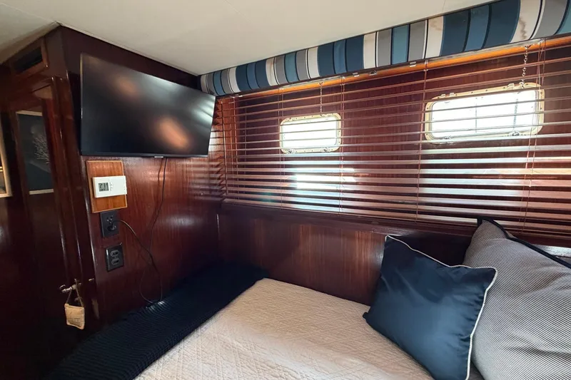 Slide: The Image of Cozy cabin interior of 1987 Hatteras 58 Motor Yacht with TV and wooden blinds. - 55